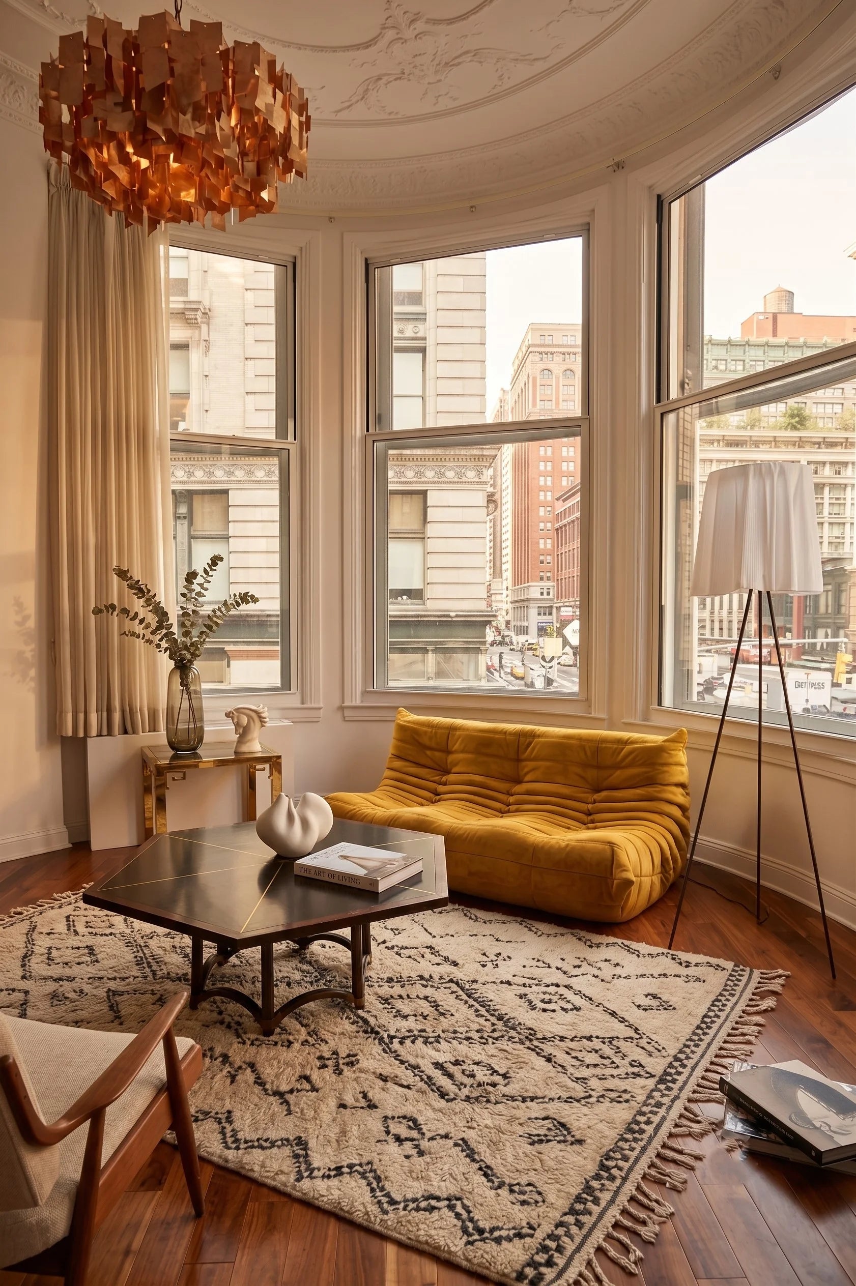 Togo-style sofa in mustard yellow in a New York loft